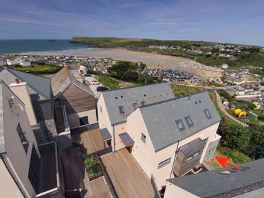 A coastal town view with houses and a beach in the background at Kellan in Polzeath