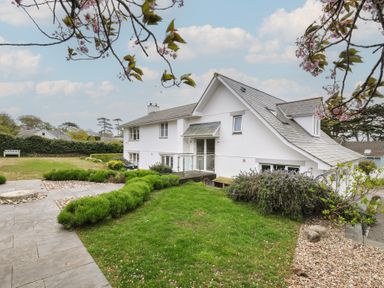 A house with a garden and stone pathway at Cherrytrees in Rock