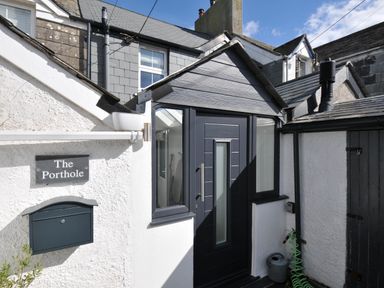 An entrance with a door and mailbox at The Porthole in Port Isaac