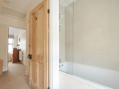 A bathroom with a bathtub and shower at The Porthole in Port Isaac