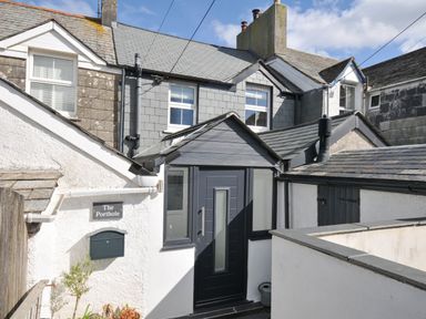 An outdoor view of a building entrance at The Porthole in Port Isaac