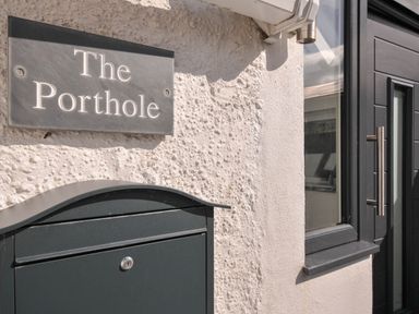 A nameplate and mailbox at The Porthole in Port Isaac