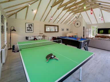 A game room with a ping pong table pool table foosball table and a sofa at Trevanion in Rock