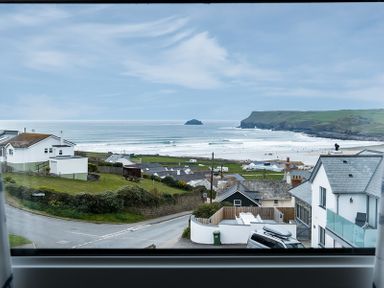 A coastal view with houses roads and a beach in the background at Pinewood 14 Polzeath