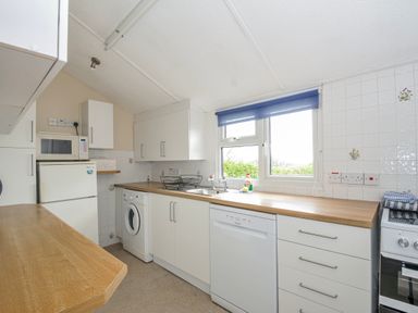 A kitchen with appliances and countertop at Hillcroft Bungalow in Daymer Bay