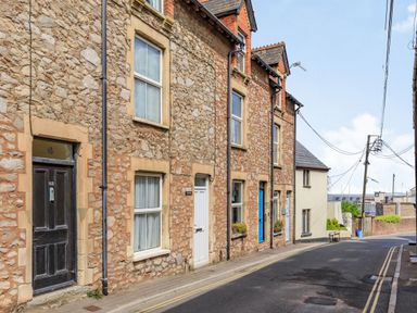 A street with stone houses and doors in different colors at Sea Spray in Watchet