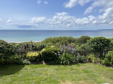 A view of the ocean and garden at Stonecroft in Praa Sands