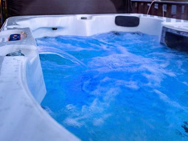 A close up of water flowing in a hot tub with bubbling water at Chi Prenn Byhan in Tintagel