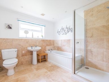 A bathroom with a toilet sink bathtub and shower at Silverdale in Rock