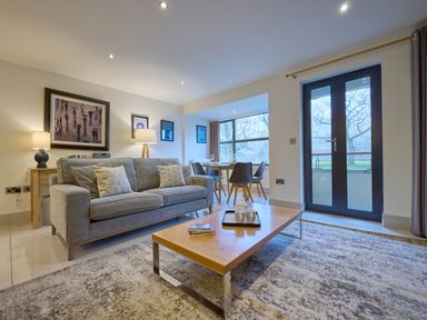 A living room with a coffee table and a sofa at Riverside Park 1 in Keswick