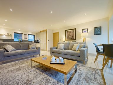 A living room with sofas and a coffee table at Riverside Park 1 in Keswick