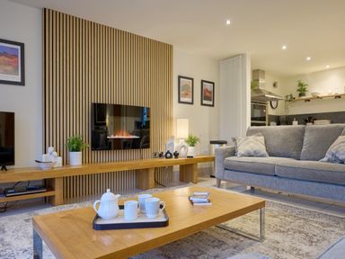 A living room with a sofa and coffee table at Riverside Park 1 in Keswick