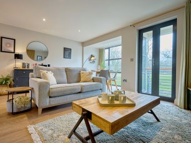 A living room with a sofa and coffee table at Riverside Park 3 in Keswick