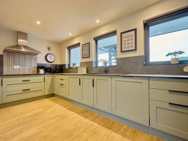 A kitchen with countertops and cabinets at Riverside Park 3 in Keswick
