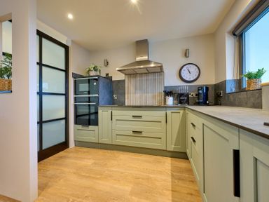 A kitchen with appliances and cabinetry at Riverside Park 3 in Keswick