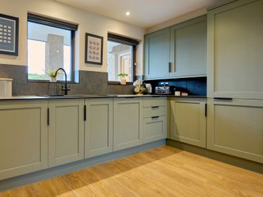 A kitchen with cabinets, sink, and appliances at Riverside Park 3 Keswick