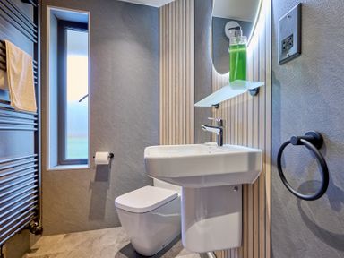 A bathroom with a sink and toilet at Riverside Park 3 in Keswick