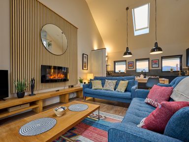 A living room with a sofa and coffee table at Riverside Park 5 in Keswick