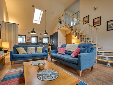 A living room with sofas and a coffee table at Riverside Park 5 in Keswick