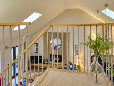 A living room with a view of a fireplace and seating area at Riverside Park 5 in Keswick