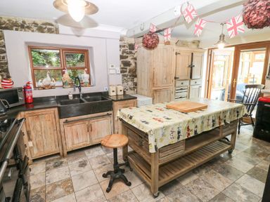 A kitchen with cabinets and a sink at The Woodlands Lower Level Stepaside
