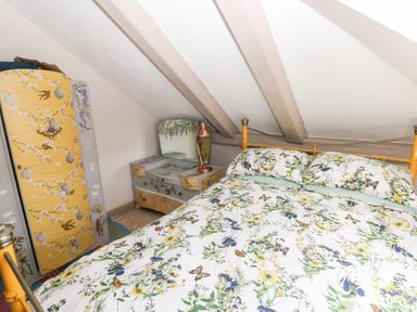 A bedroom with a bed and storage furniture at The Woodlands Lower Level in Stepaside