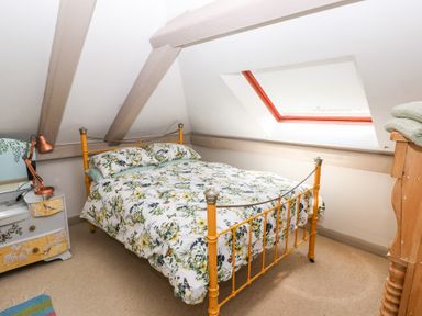 A bedroom with a bed and desk at The Woodlands Lower Level Stepaside