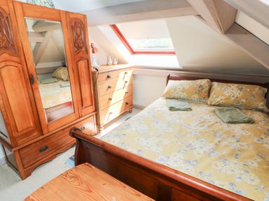 A bedroom with a bed and wardrobe at The Woodlands Lower Level Stepaside