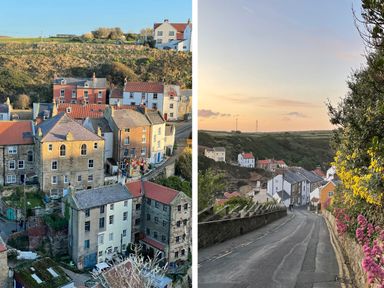 A village with houses on a hillside and a road lined with houses and flowers at Bethel Chapel in Staithes