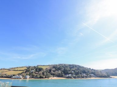 A river with houses and hills in the background at Landmark in Salcombe