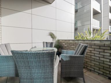 A balcony with a table and chairs at 13 Cliff Edge in Newquay