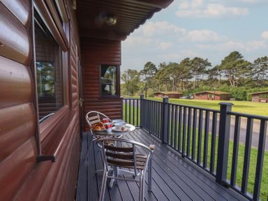 A balcony with table and chairs at Bugle in Saltburn-By-The-Sea