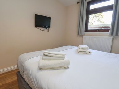 A bedroom with a bed and towels on it at Bugle in Saltburn-By-The-Sea