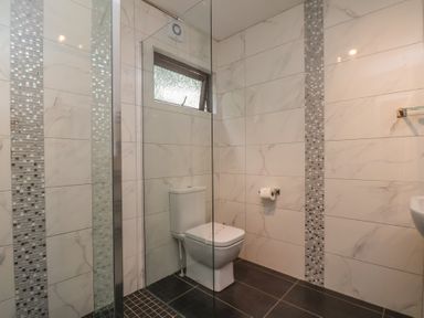 A bathroom with a toilet and sink at Bugle in Saltburn-By-The-Sea