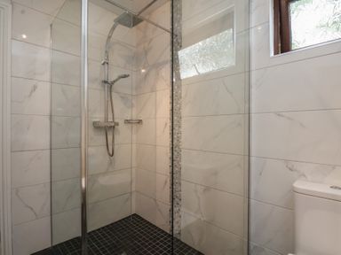 A bathroom with a shower and toilet at Bugle in Saltburn-By-The-Sea