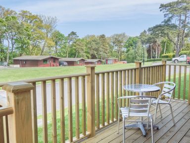 An outdoor area with a table and chairs at Lavender Lodge in Saltburn-By-The-Sea