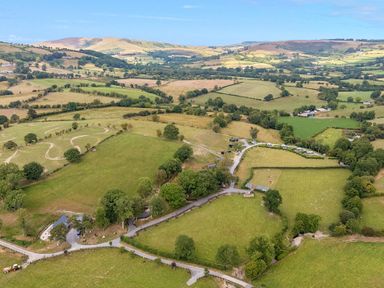 An aerial view of fields and hills at Oak Tree View in Nantmel near Rhayader