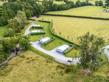 An aerial view of outdoor shelters and a road at Oak Tree View Nantmel near Rhayader