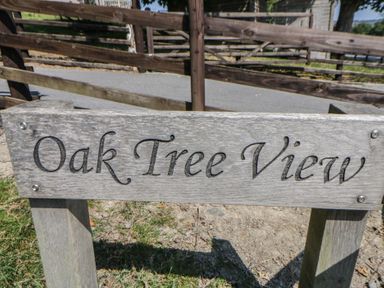 A wooden sign that reads Oak Tree View at Oak Tree View Nantmel near Rhayader