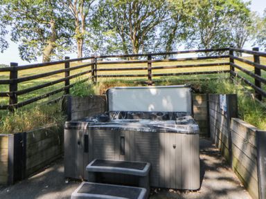 An outdoor area with a hot tub and steps at Oak Tree View Nantmel near Rhayader