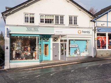 A street view of shops Rebel Rose boutique nursery shop and herdy gift shop at Fenty's in Bowness-On-Windermere