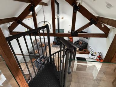 A living room with a sofa and coffee table at Bank Hurst Coach House in Ulverston