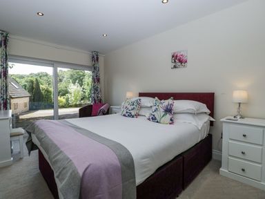 A bedroom with a bed and window at Bell Garden in Stow-On-The-Wold