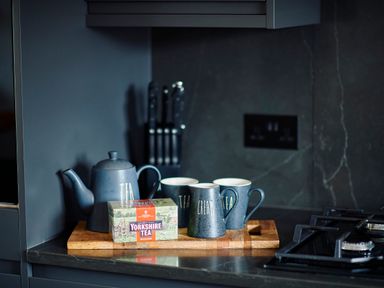A kitchen counter with a teapot mugs and a box of Yorkshire Tea at Ingleborough Lodge in Rathmell near Settle