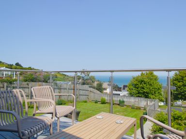 A balcony with seating and a view of the sea at 65 Channel View Ilfracombe