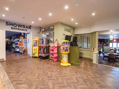 A lobby with vending machines and showbar entrance at Nest Cottage in St Tudy