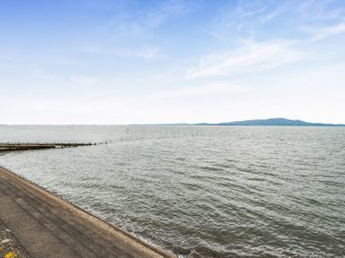 A view of water with a pier in the foreground at Solway View, Skinburness near Silloth