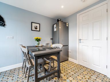 A kitchen with a table and chairs at Solway View in Skinburness near Silloth