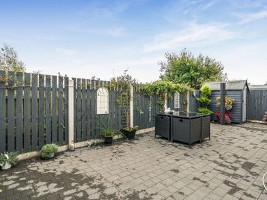 A garden area with outdoor furniture and planters at Solway View in Skinburness near Silloth