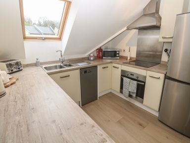 A kitchen with appliances and countertop at Upper Deck in Truro